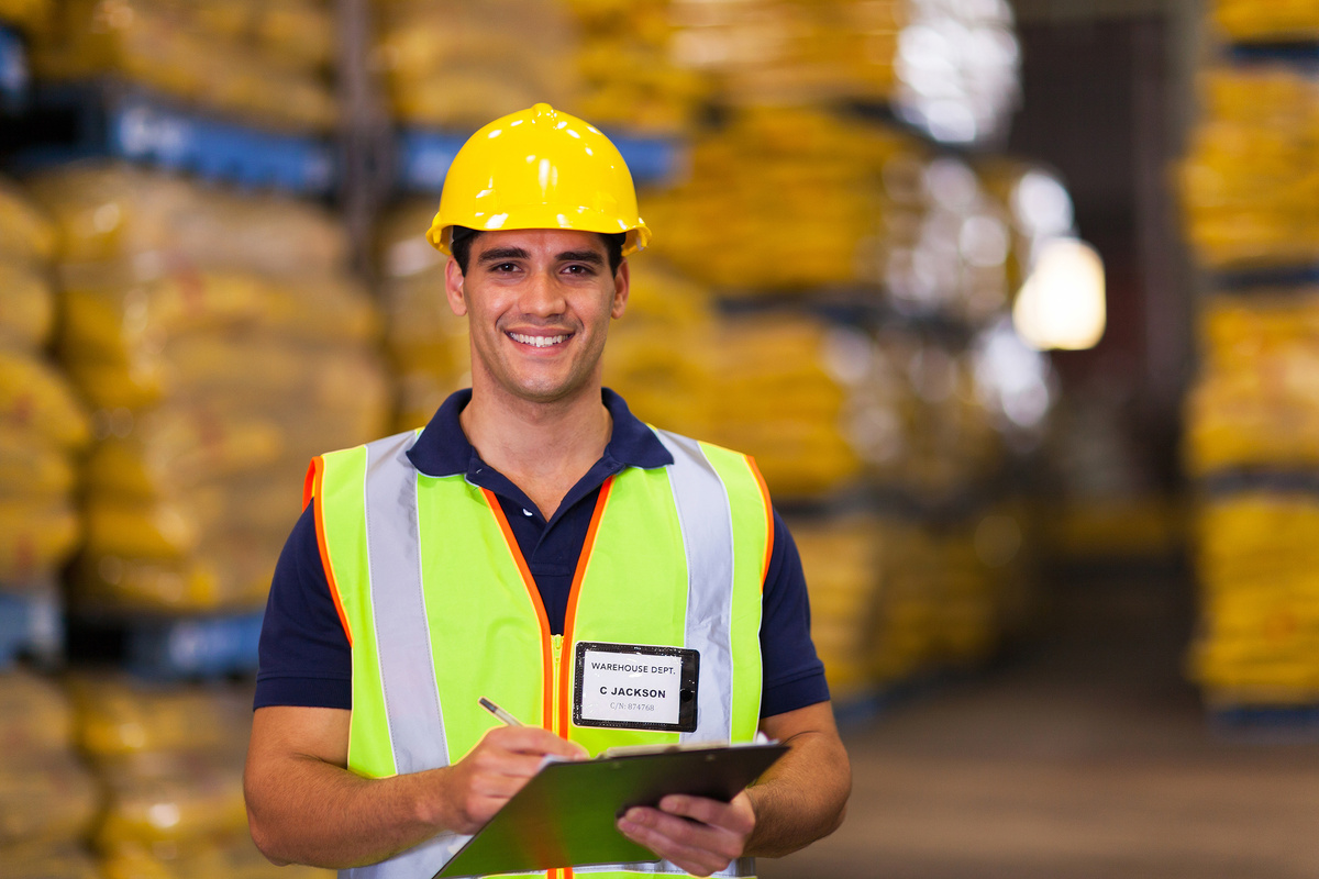 A young handsome warehouse worker